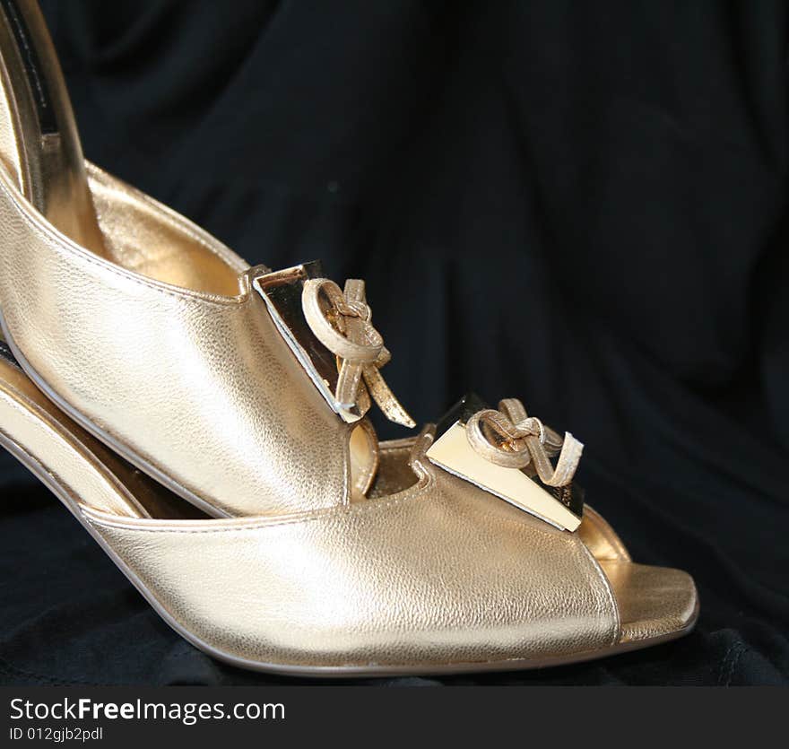 Woman golden shoes