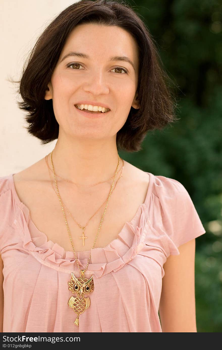 Portrait of smiling brunet woman, outdoors. Portrait of smiling brunet woman, outdoors