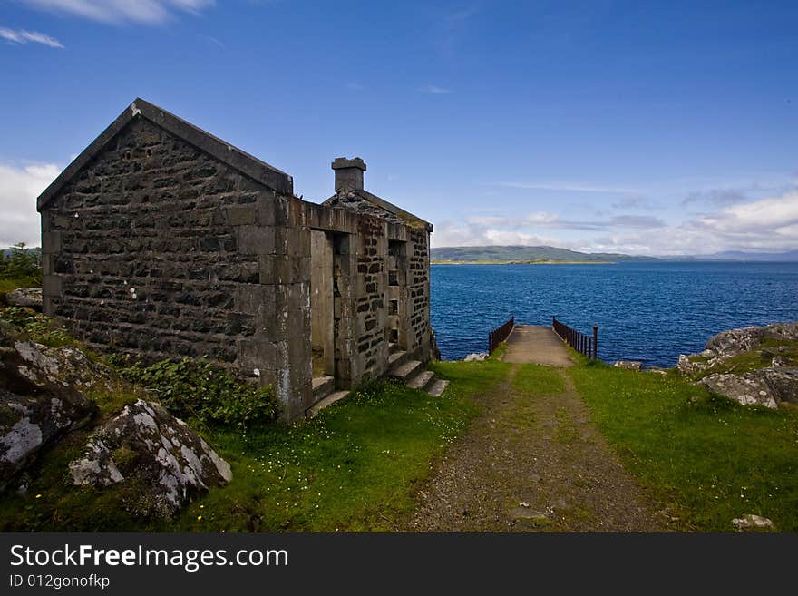 The abandoned cottage on the edge of a Scottish loch in the Highlands