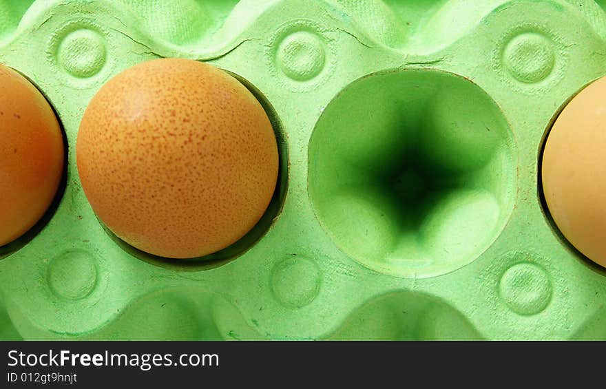 Brown Eggs in a green Box