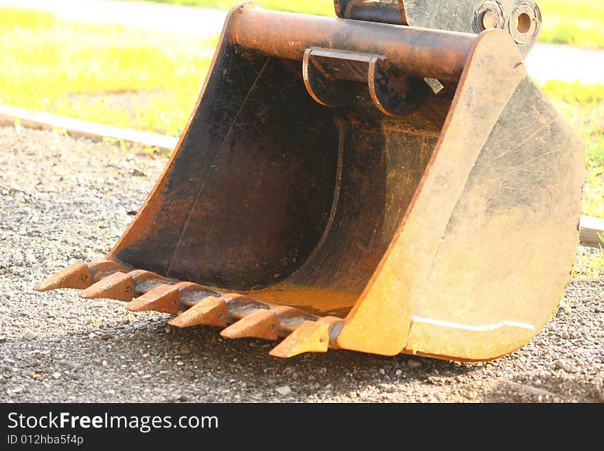 Lifting bucket on arm of equipment. Lifting bucket on arm of equipment