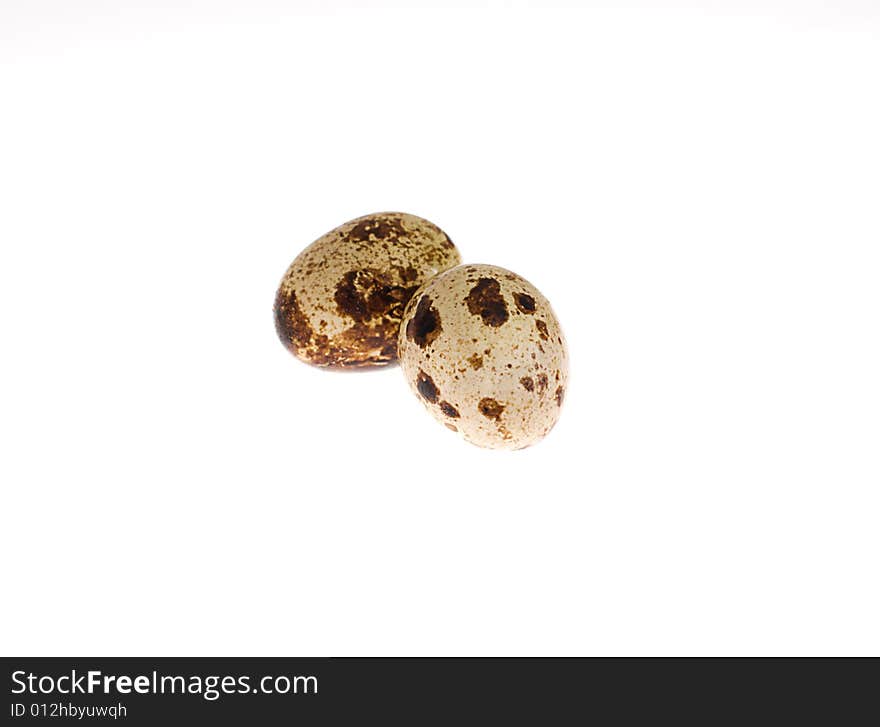 Quails' eggs on the white background