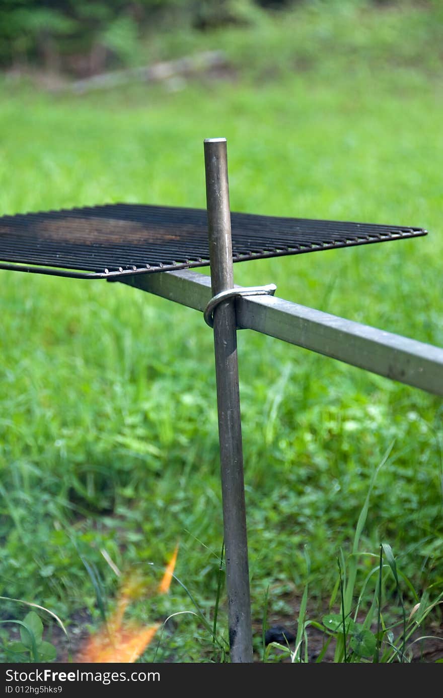 Cook out grate swung back from over the fire