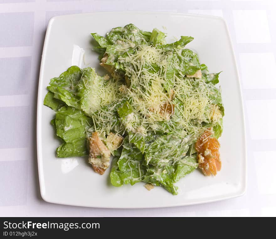 Fresh cesar salad on white plate. Fresh cesar salad on white plate