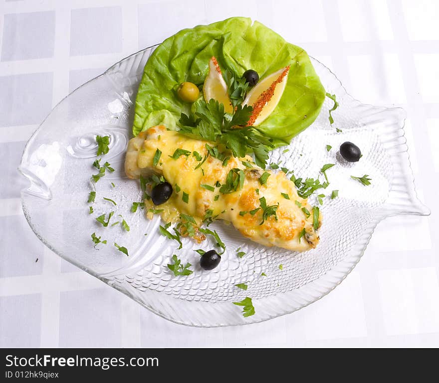 Fish decorated with salad