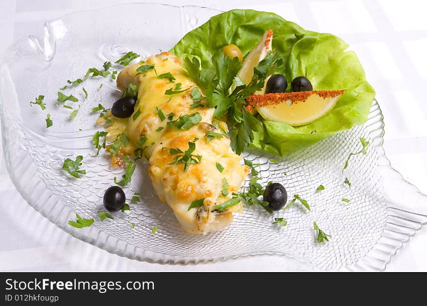 Fish decoratet with salad on plate. Fish decoratet with salad on plate