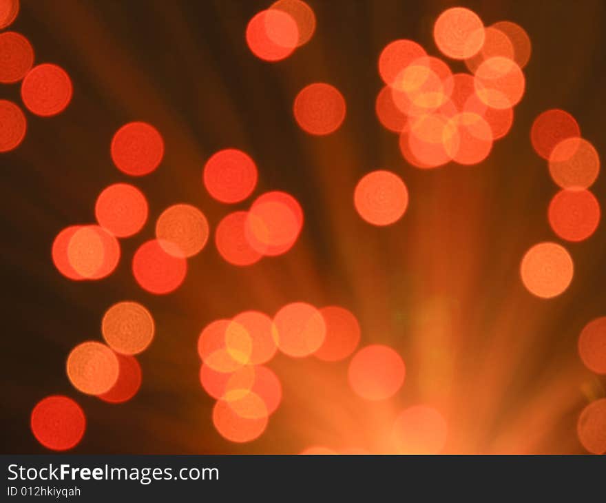 Background image composed of overlapping orange and red spots of light. Background image composed of overlapping orange and red spots of light