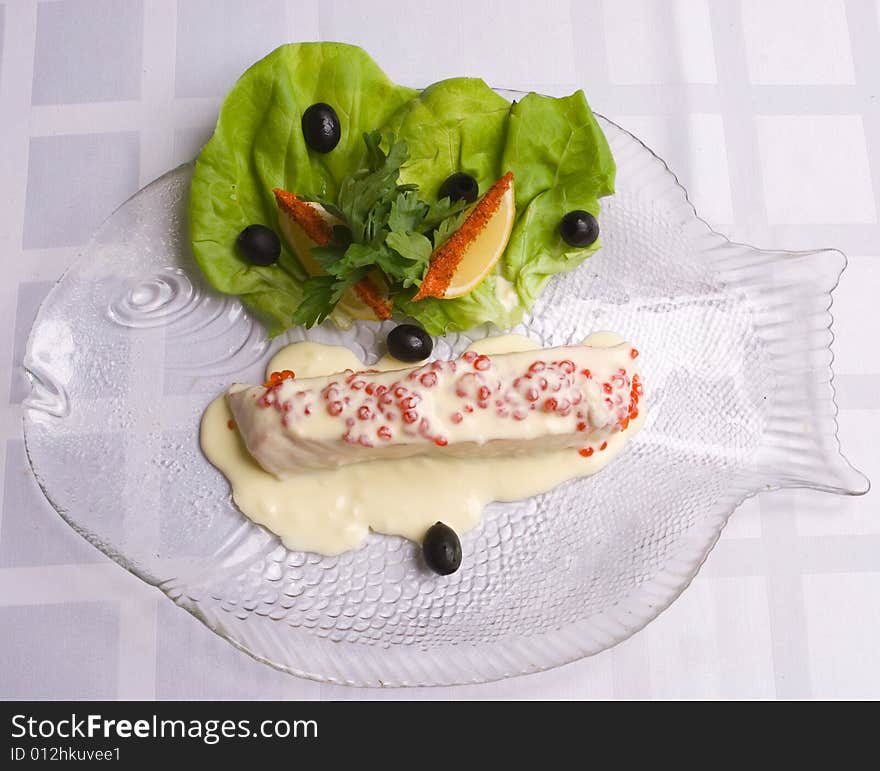 Salmon decorated with salad