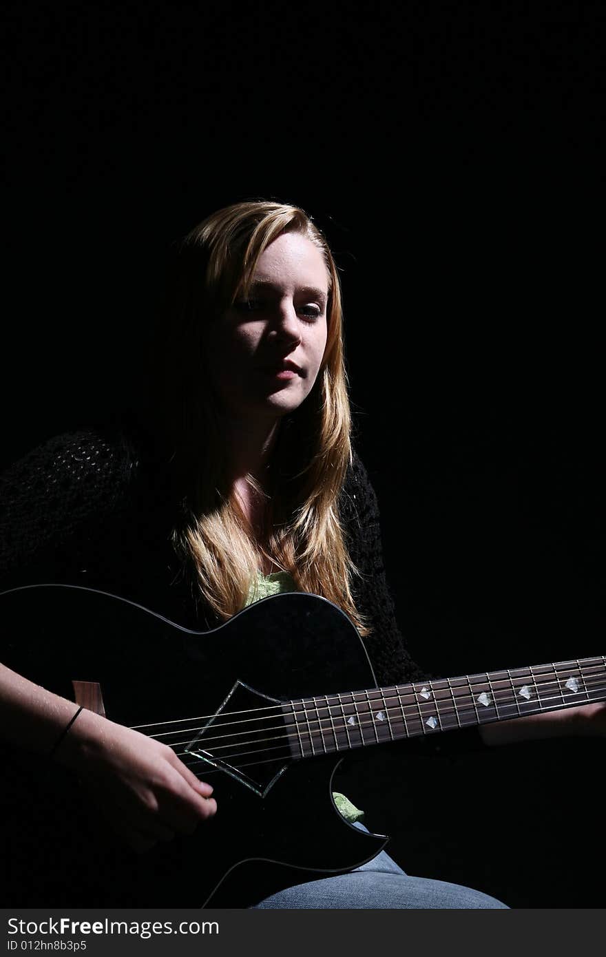 Moody woman with guitar