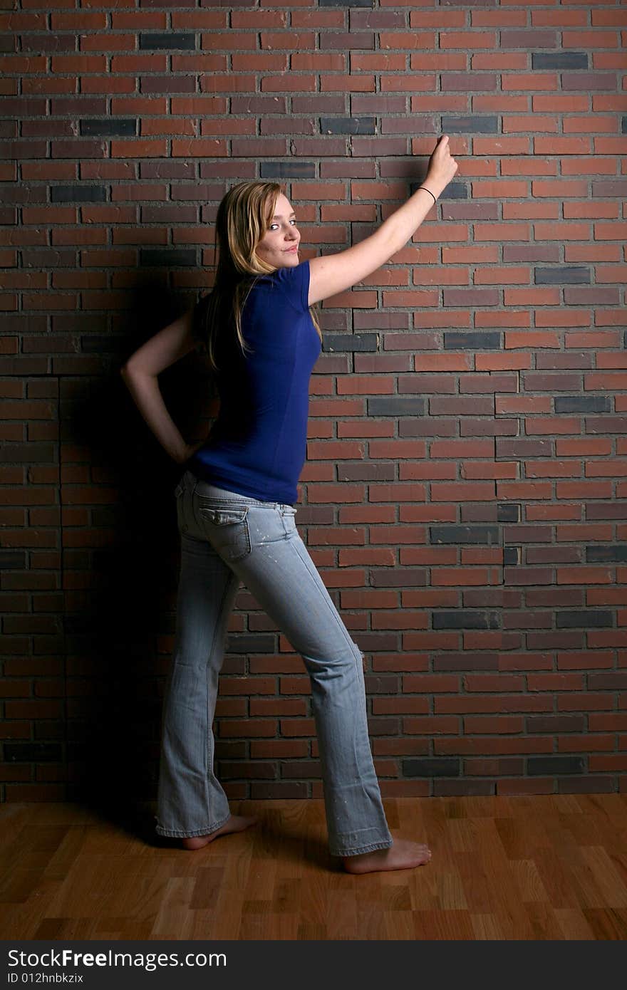 Woman Next To Brick Wall