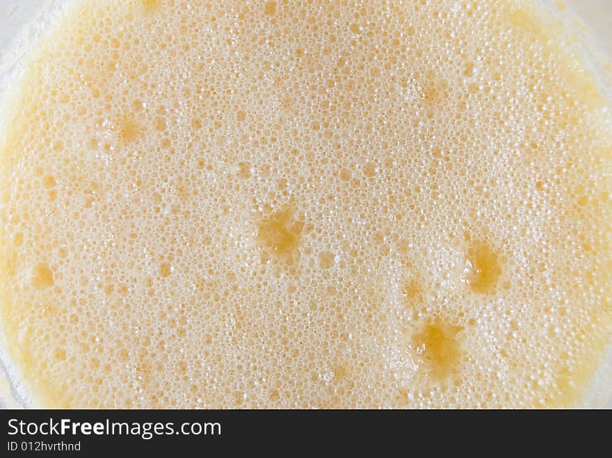 Closeup of froth of orange juice. Closeup of froth of orange juice