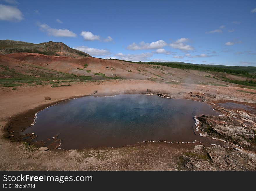 Clear lagoon on a geothermal field. Clear lagoon on a geothermal field.