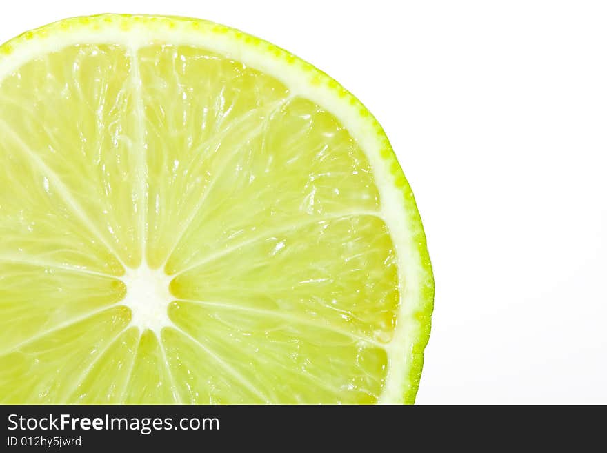 Fresh slice of lime isolated on white. Fresh slice of lime isolated on white