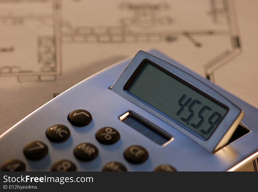 A Calculator and house layout. A Calculator and house layout