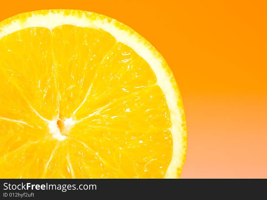 Fresh slice of orange with zesty gradient lighting. Fresh slice of orange with zesty gradient lighting