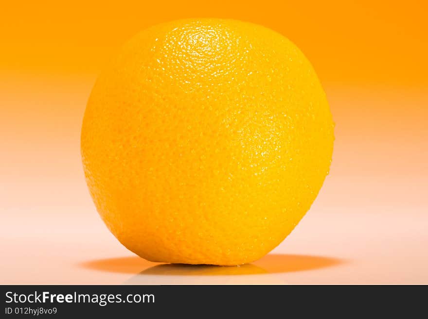 Fresh slice of orange with zesty gradient lighting. Fresh slice of orange with zesty gradient lighting