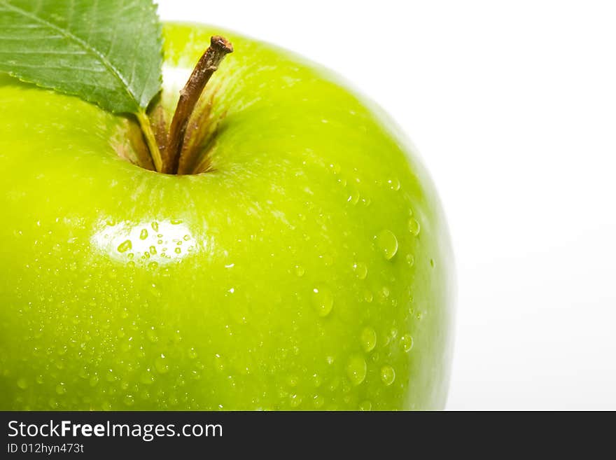 Fresh green apple isolated on white with water droplets