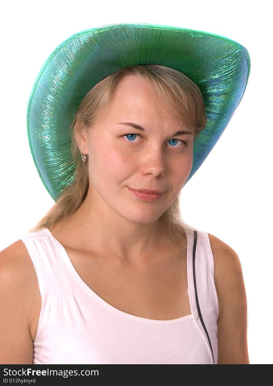 The beautiful girl in a green cowboy's hat. Isolated