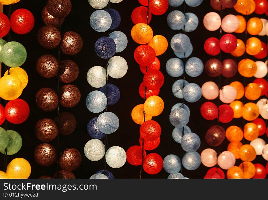 Many colorful balls in differently colors taken at night