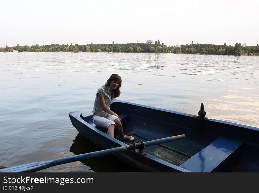 Girl rowing a boat