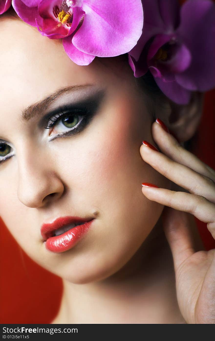 Beauty portrait of a young beautiful woman with flowers