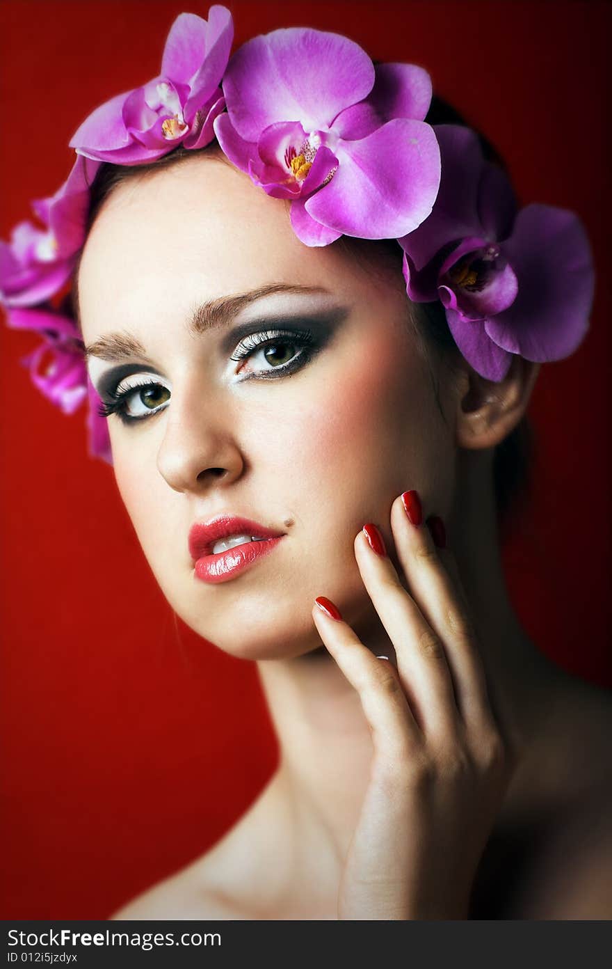 Beauty Portrait Of A Woman With Flowers