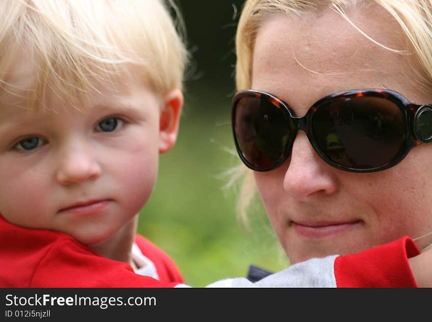 Small child with mom watching. Small child with mom watching