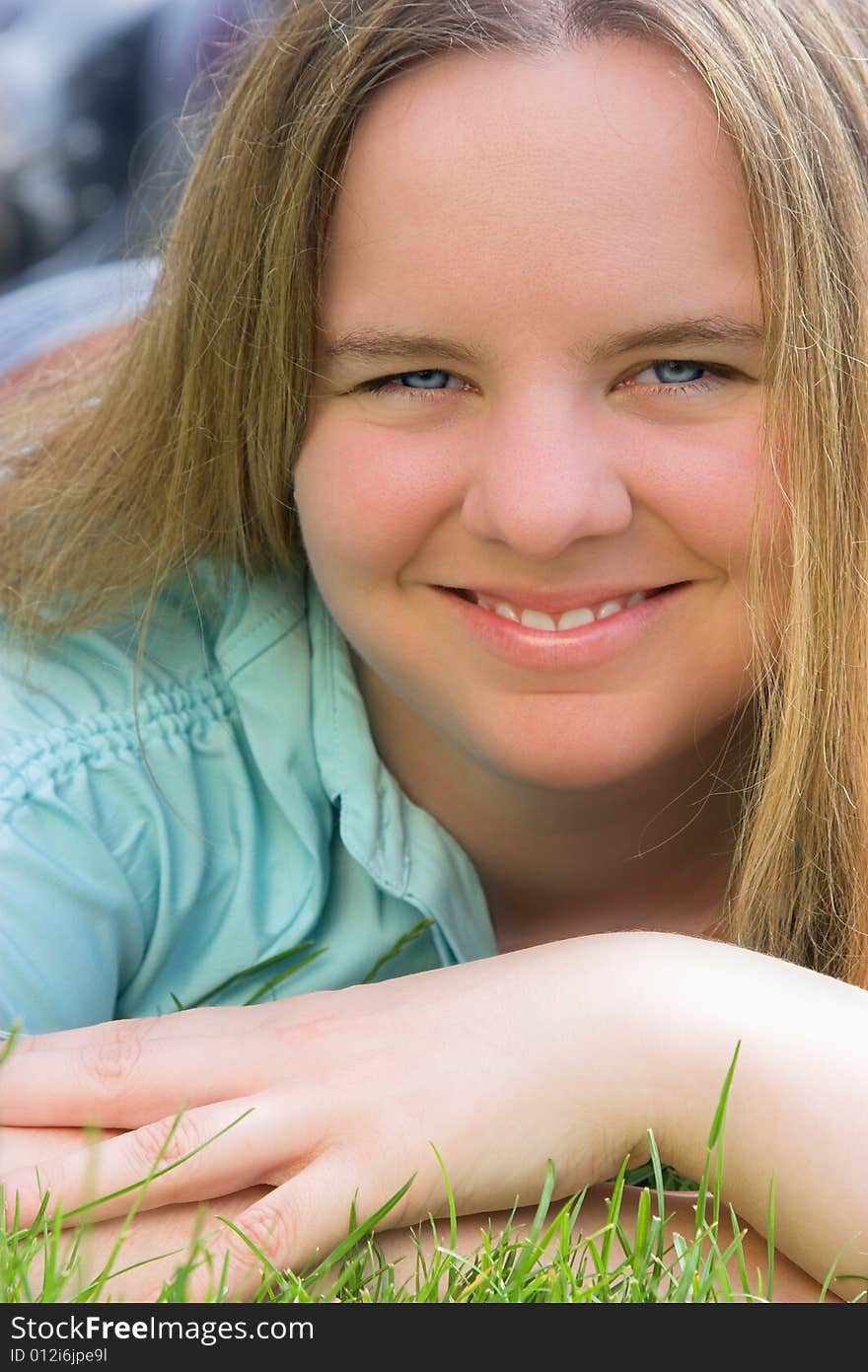 Portrait of a attractive blond woman with blue eyes.