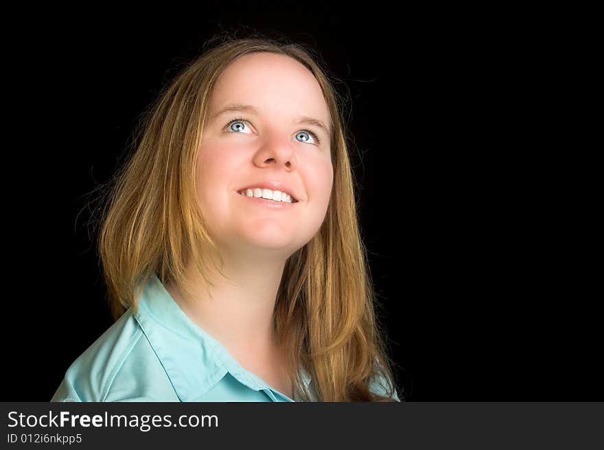 Attractive blond woman with blue eyes look up.