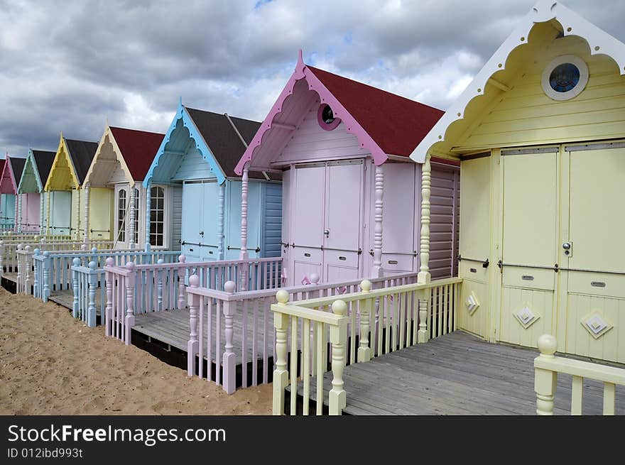 Shot of the beach and some colourful huts. Shot of the beach and some colourful huts