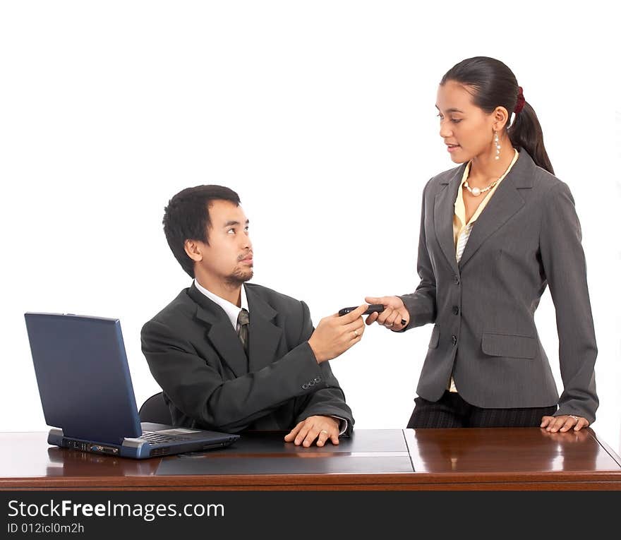 Attractive secretary hand over the phone to her boss