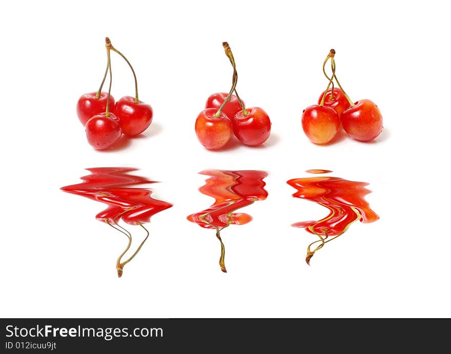 Three clusters of a sweet cherry with reflection. Three clusters of a sweet cherry with reflection