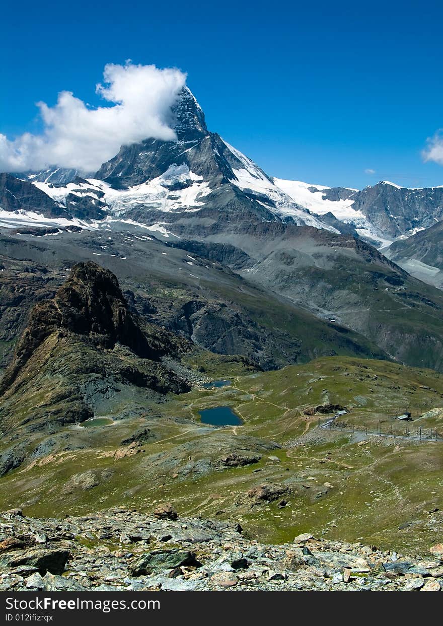 Matterhorn (Monte Cervino) is one of the highest summits from Europe (4478 m altitude) at the border between Switzerland and Italy.

The mountain derives its name from the German words Matte, meaning meadow, and Horn, which means peak.  On the border between Switzerland and Italy, it towers over the Swiss village of Zermatt and the Italian village Breuil-Cervinia in the Val Tournanche. . Matterhorn (Monte Cervino) is one of the highest summits from Europe (4478 m altitude) at the border between Switzerland and Italy.

The mountain derives its name from the German words Matte, meaning meadow, and Horn, which means peak.  On the border between Switzerland and Italy, it towers over the Swiss village of Zermatt and the Italian village Breuil-Cervinia in the Val Tournanche.