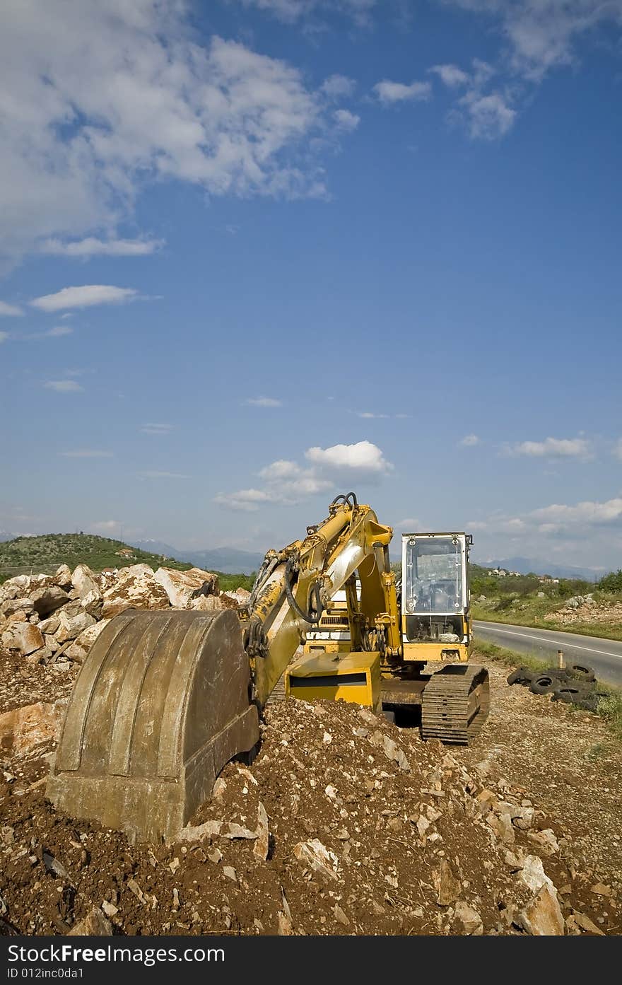 Old excavator on the municipal waiting next working day.