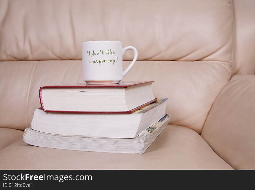 A cup of coffee on book