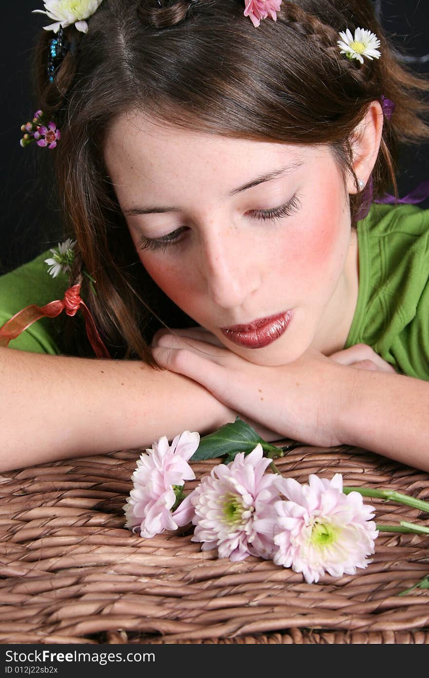 Teenage model with flowers and butterflies in her hair. Teenage model with flowers and butterflies in her hair