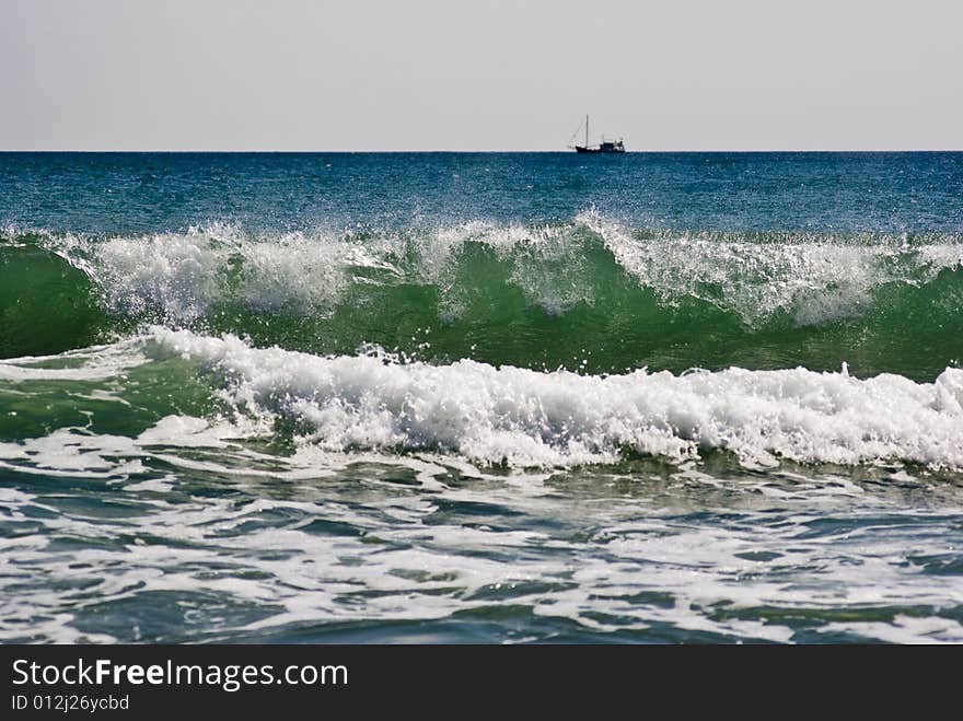 Black Sea waves in foreground with ship on horizon. Black Sea waves in foreground with ship on horizon