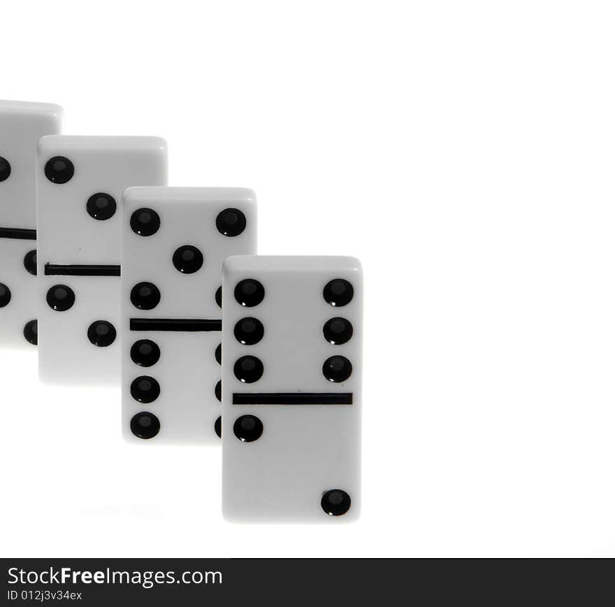 Dominoes on white background, close up