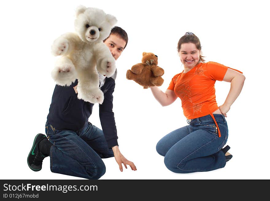 Girl and young man playing with toys sitting on floor