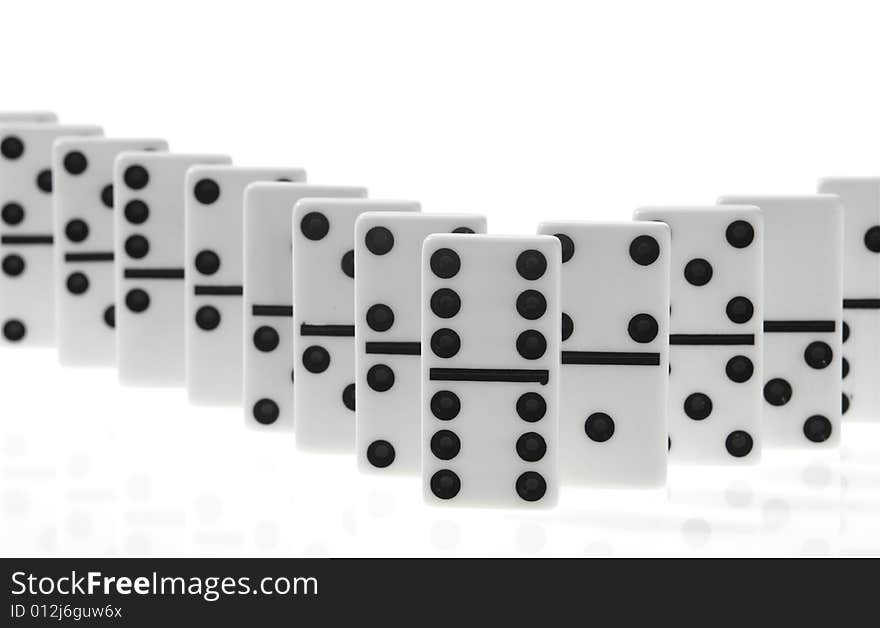 Dominoes on white background, close up