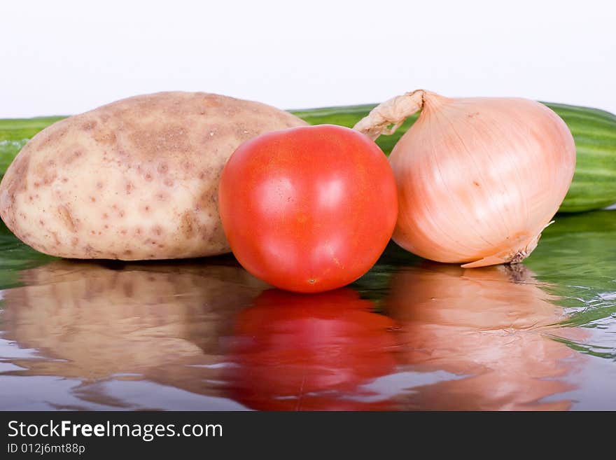 Fresh vegetables reflected on a piece of aluminum foil. Fresh vegetables reflected on a piece of aluminum foil