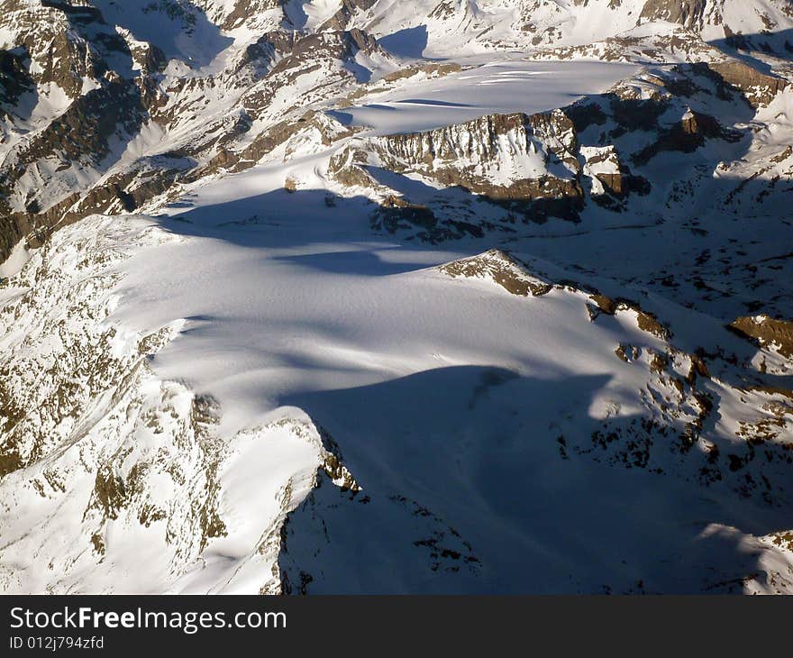 Snow scene of the Alps mountains, taken  during a flight over the border between France and Italy. Snow scene of the Alps mountains, taken  during a flight over the border between France and Italy