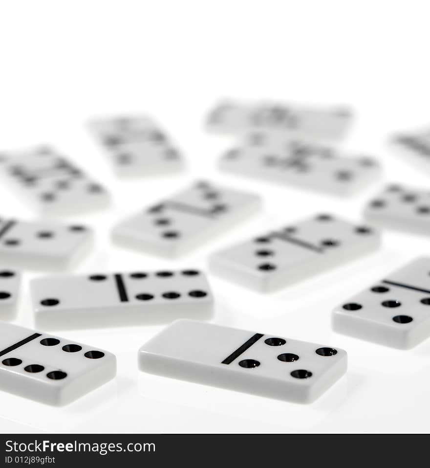 Dominoes on white background, close up