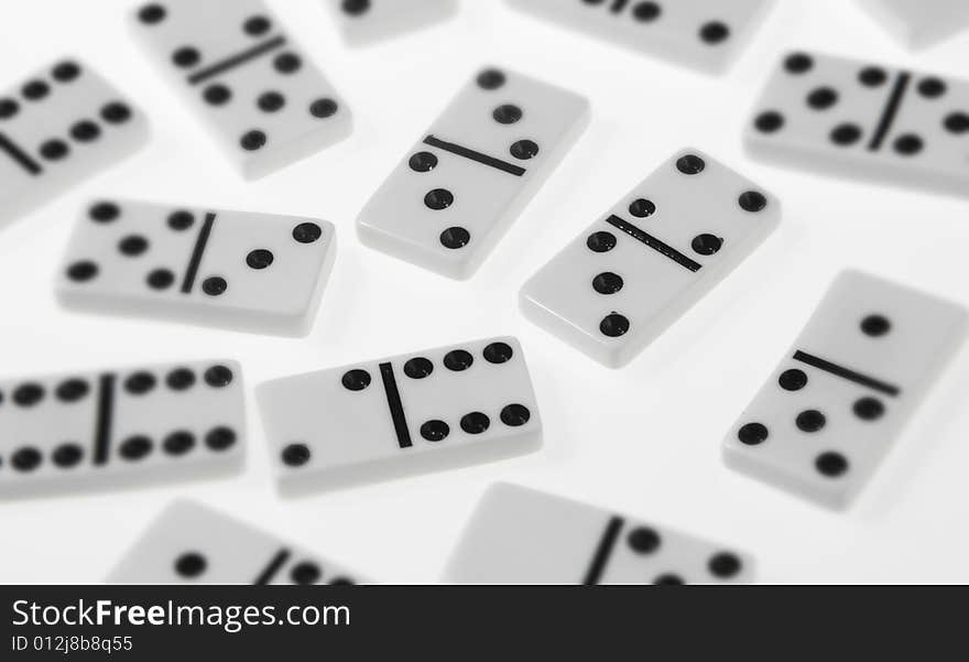 Dominoes on white background, close up