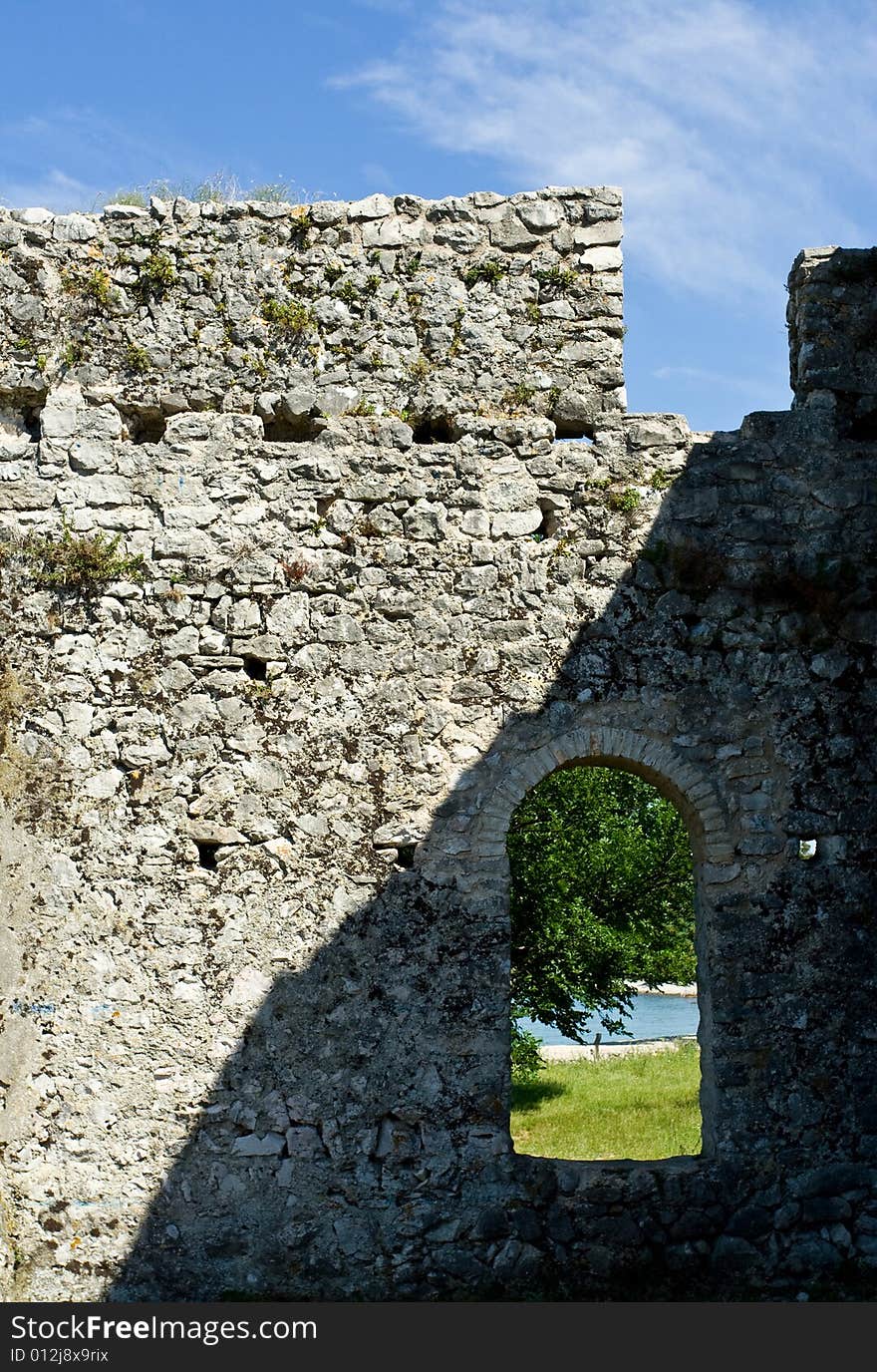 Beach view through old castle window