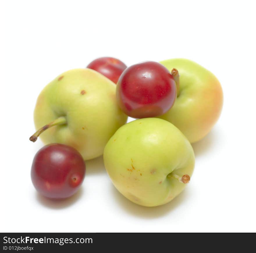 Apples and plums isolated on white