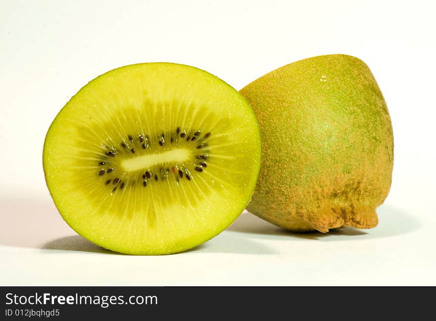 Golden kiwi fruit on white