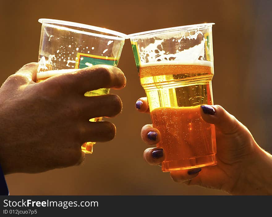 Beer in glasses in hands