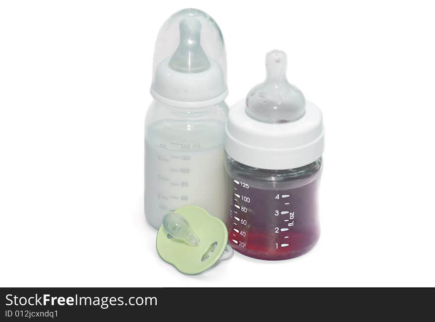 Bottles with milk and juice on a white background