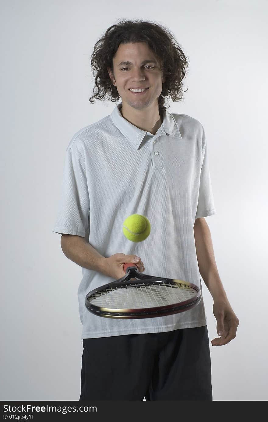 Man Balances a Tennis Ball - Vertical